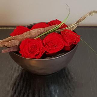 Composizione rose rosse